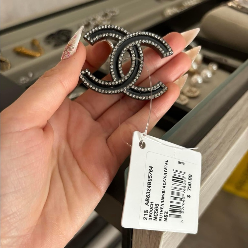 Chanel brooche never worn brand new either tax and box